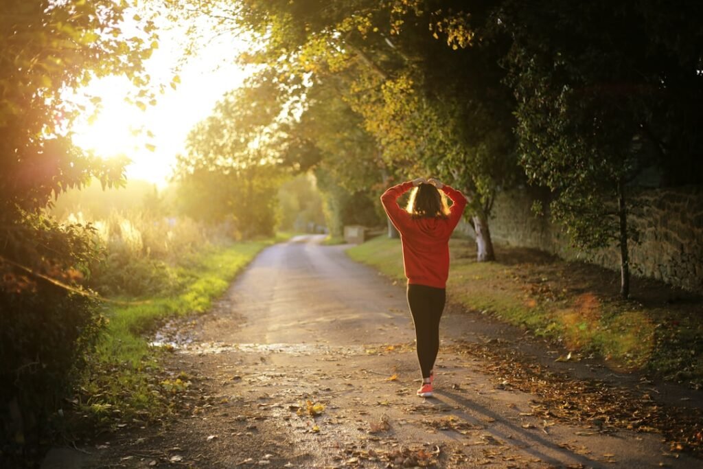 Person walking outdoors as part of a healthy and active lifestyle