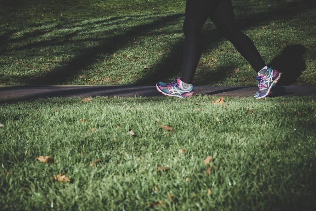 Person jogging outdoors as part of a healthy exercise routine