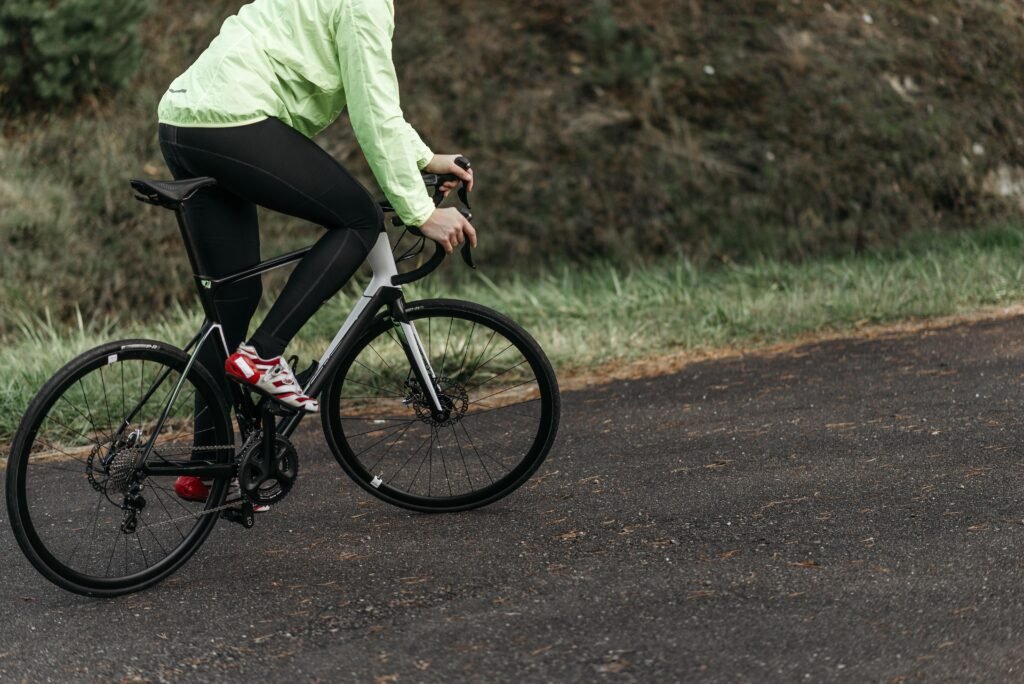 A cyclist riding a road bike outdoors