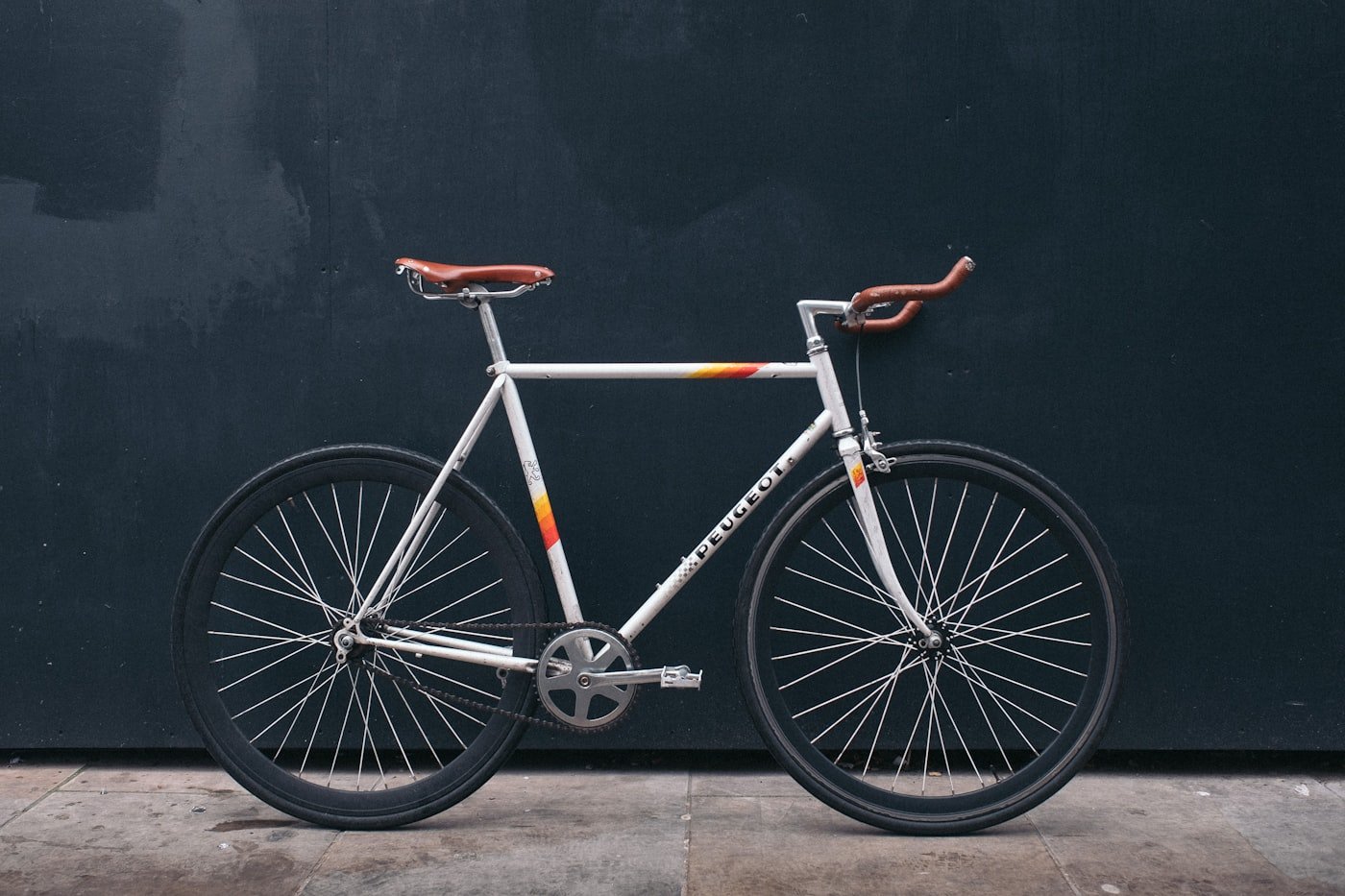 A bicycle resting on a quiet road