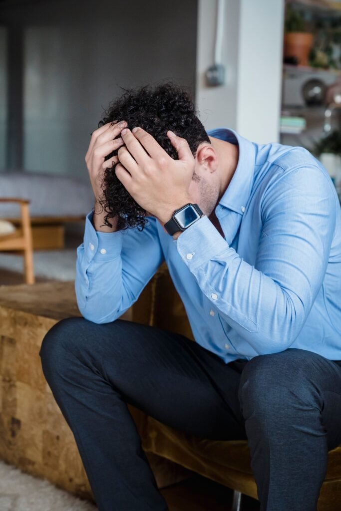 An exhausted person sitting on a couch
