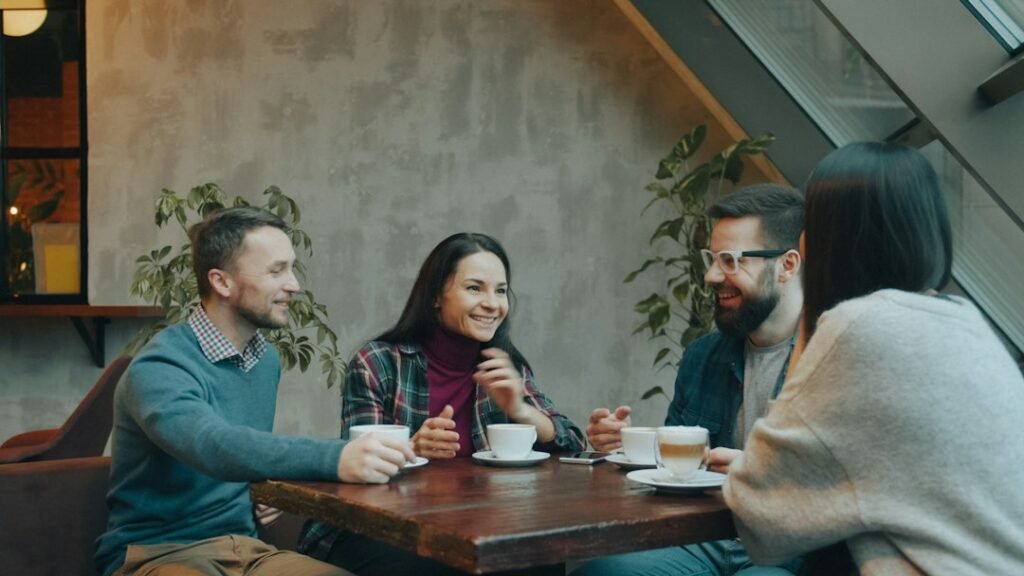 Friends talking together in a cafe